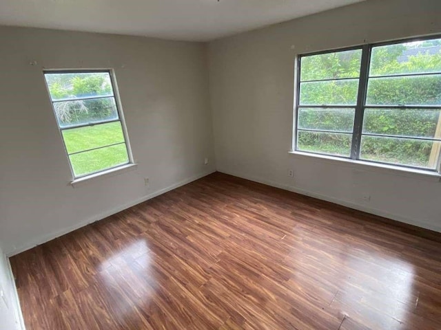 5715 Belmark St, Houston, TX 77033 - spare room with wood finished floors and baseboards