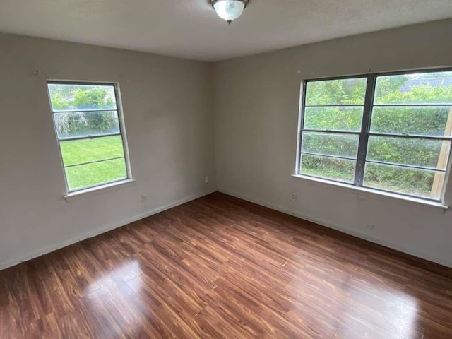 5715 Belmark St, Houston, TX 77033 - empty room featuring wood finished floors and baseboards