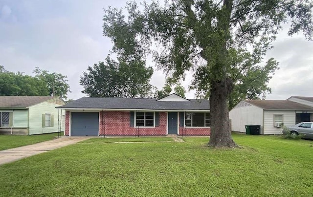 5715 Belmark St, Houston, TX 77033 - single story home featuring an attached garage, driveway, brick siding, and a front yard