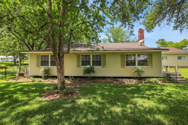 151 Lakeview Cir, Coldspring, TX 77331 - rear view of property with a chimney