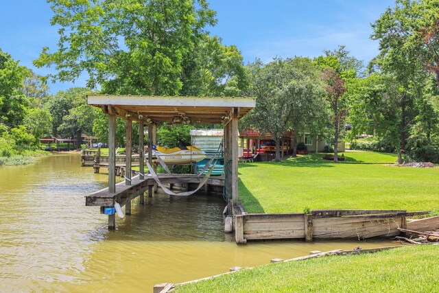 151 Lakeview Cir, Coldspring, TX 77331 - dock area with boat lift, a water view, and a lawn