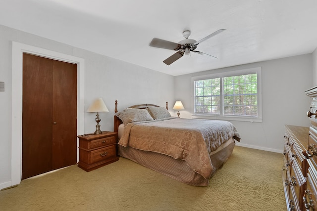 151 Lakeview Cir, Coldspring, TX 77331 - bedroom featuring light carpet, baseboards, and a ceiling fan