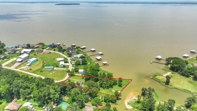 151 Lakeview Cir, Coldspring, TX 77331 - aerial perspective of suburban area with a nearby body of water and property parcel outlined