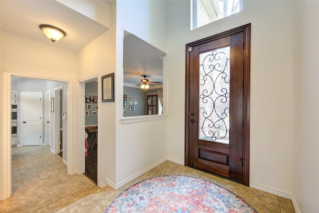 12306 Heatherwick Dr, Cypress, TX 77429 - entryway with a high ceiling, ceiling fan, and baseboards