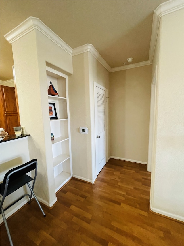 1711 Old Spanish Trl Unit 127, Houston, TX 77054 - hallway with wood finished floors, crown molding, baseboards, and built in shelves