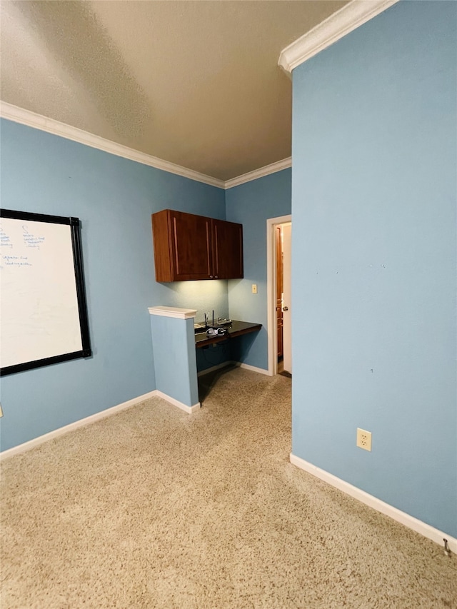 1711 Old Spanish Trl Unit 127, Houston, TX 77054 - spare room with crown molding, baseboards, and light carpet