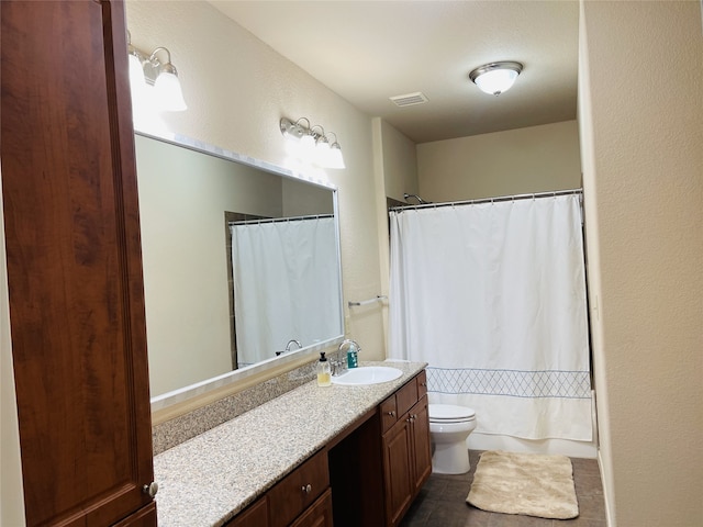 1711 Old Spanish Trl Unit 127, Houston, TX 77054 - bathroom with vanity, toilet, and tile patterned floors