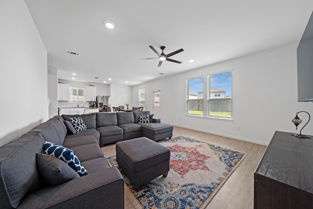 23515 Weir Box Rd, Hockley, TX 77447 - living area featuring ceiling fan, plenty of natural light, light wood finished floors, recessed lighting, and baseboards