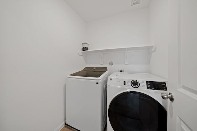 23515 Weir Box Rd, Hockley, TX 77447 - laundry room with washing machine and clothes dryer
