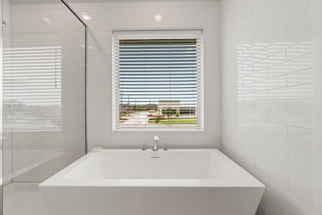 11231 Buchanan Coves Ln, Cypress, TX 77433 - full bath with a freestanding tub and tile walls
