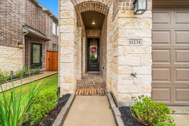 11231 Buchanan Coves Ln, Cypress, TX 77433 - doorway to property with stone siding and a garage