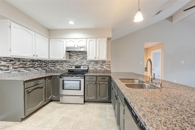 2311 Pepperweed Dr, Houston, TX 77084 - kitchen with stainless steel appliances, a sink, under cabinet range hood, tasteful backsplash, and white cabinetry