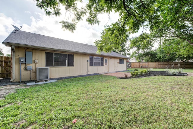 2311 Pepperweed Dr, Houston, TX 77084 - rear view of house featuring central AC unit and a shingled roof