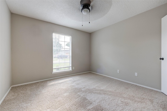 2311 Pepperweed Dr, Houston, TX 77084 - spare room with carpet, baseboards, a textured ceiling, and ceiling fan