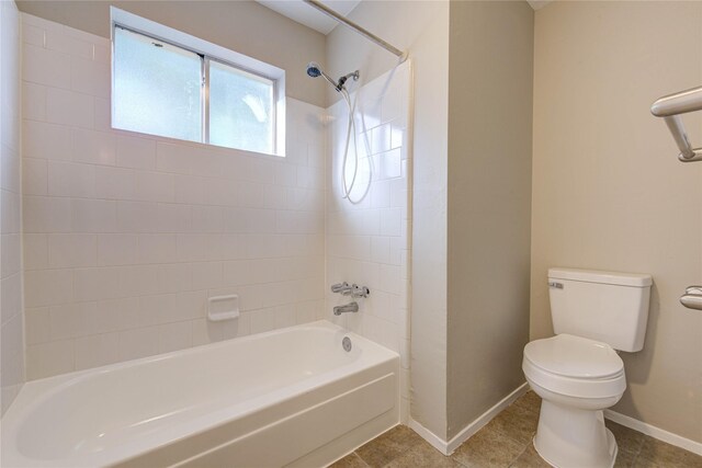 2311 Pepperweed Dr, Houston, TX 77084 - full bath featuring toilet, baseboards, shower / washtub combination, and tile patterned flooring