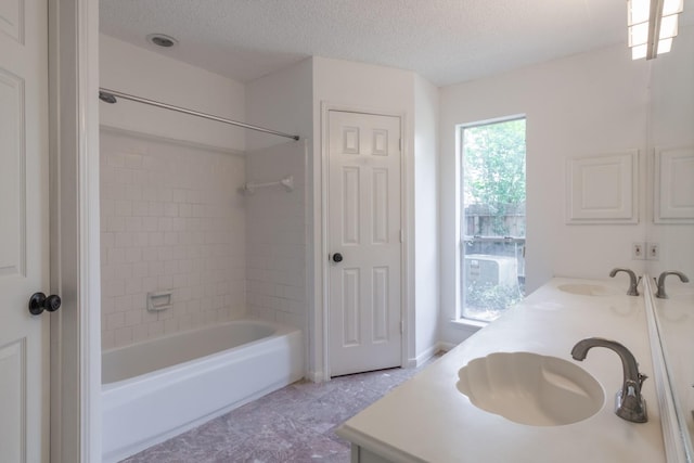 10107 Sands Trail Ct, Houston, TX 77064 - full bath with double vanity, bathing tub / shower combination, a textured ceiling, and tile patterned floors