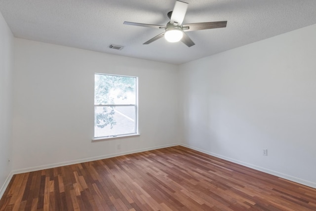 10107 Sands Trail Ct, Houston, TX 77064 - spare room with wood finished floors, ceiling fan, baseboards, and a textured ceiling