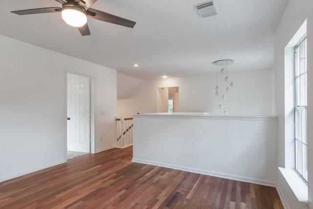 10107 Sands Trail Ct, Houston, TX 77064 - spare room featuring ceiling fan, dark wood-style flooring, plenty of natural light, baseboards, and recessed lighting