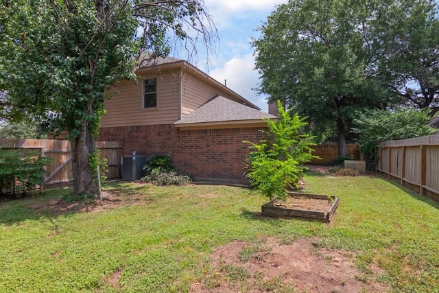 10107 Sands Trail Ct, Houston, TX 77064 - view of yard with central air condition unit and a vegetable garden