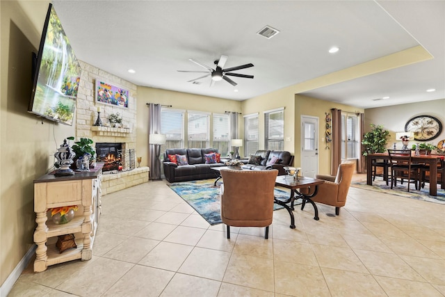 26020 Bassfield Ln, Katy, TX 77494 - living area featuring ceiling fan, a fireplace, light tile patterned floors, recessed lighting, and baseboards