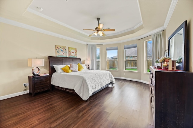26020 Bassfield Ln, Katy, TX 77494 - bedroom with a raised ceiling, ornamental molding, dark wood-type flooring, baseboards, and ceiling fan