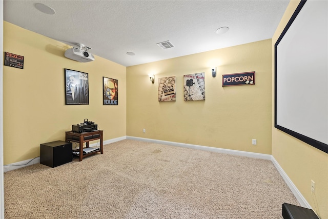 26020 Bassfield Ln, Katy, TX 77494 - carpeted cinema room featuring a textured ceiling and baseboards