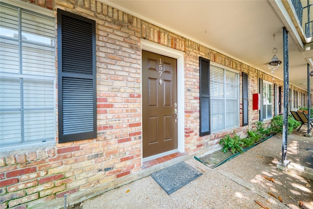 3224 Timmons Ln Unit 157, Houston, TX 77027 - entrance to property with a porch and brick siding