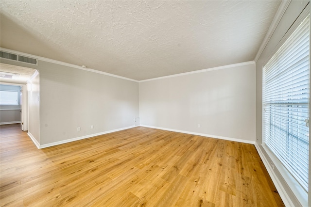 3224 Timmons Ln Unit 157, Houston, TX 77027 - unfurnished room featuring light wood finished floors, a textured ceiling, baseboards, and crown molding