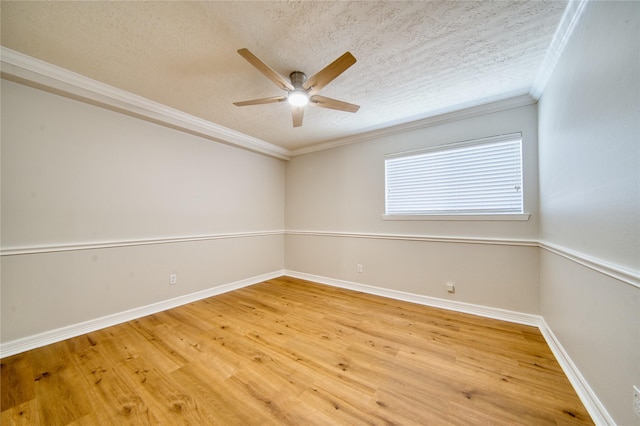 3224 Timmons Ln Unit 157, Houston, TX 77027 - spare room featuring ceiling fan, a textured ceiling, ornamental molding, light wood-style floors, and baseboards