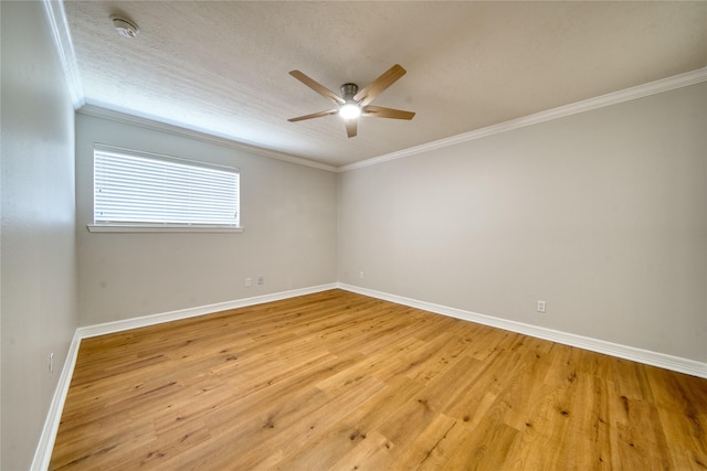 3224 Timmons Ln Unit 157, Houston, TX 77027 - empty room featuring a ceiling fan, baseboards, light wood-type flooring, a smoke detector, and ornamental molding