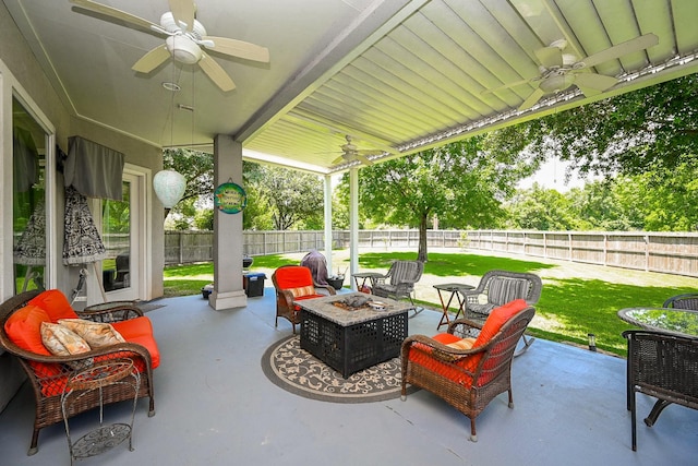 57 Cloverdale Ct, Montgomery, TX 77356 - view of patio / terrace featuring a ceiling fan and an outdoor fire pit