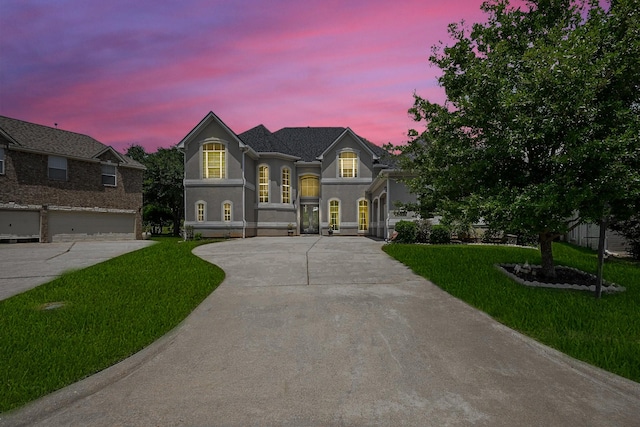 57 Cloverdale Ct, Montgomery, TX 77356 - view of front of property featuring concrete driveway, a front yard, and stucco siding