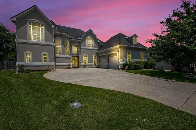 57 Cloverdale Ct, Montgomery, TX 77356 - view of front facade with an attached garage, stucco siding, and driveway