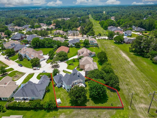 57 Cloverdale Ct, Montgomery, TX 77356 - aerial perspective of suburban area featuring property parcel outlined