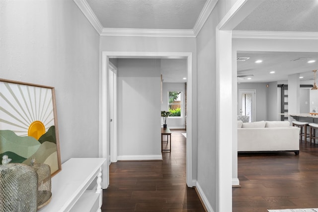 1139 Lehman St, Houston, TX 77018 - hall featuring dark wood finished floors, a textured ceiling, baseboards, and ornamental molding