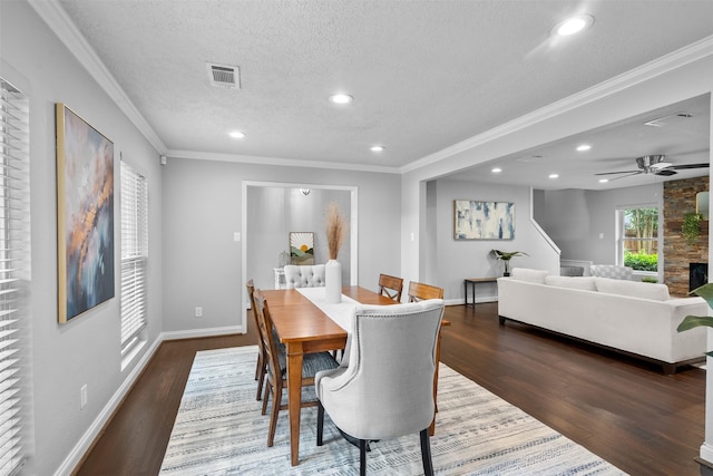 1139 Lehman St, Houston, TX 77018 - dining space with wood finished floors, a textured ceiling, baseboards, recessed lighting, and crown molding