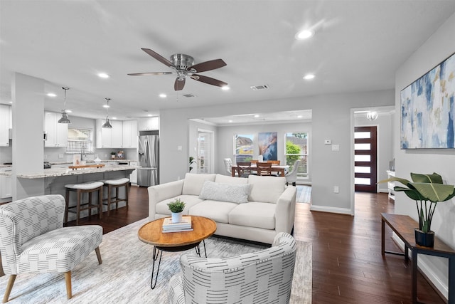 1139 Lehman St, Houston, TX 77018 - living room with recessed lighting, dark wood-style floors, ceiling fan, and baseboards