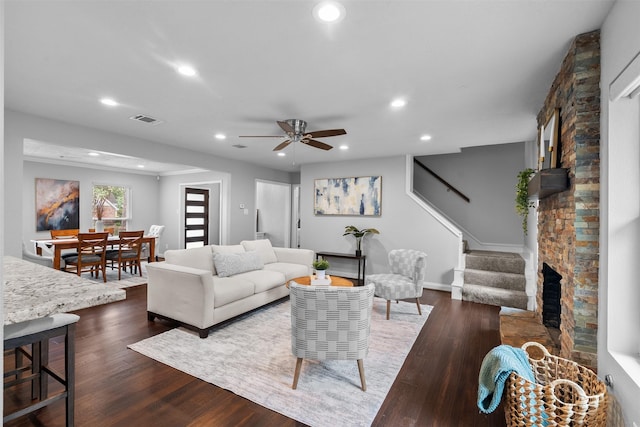 1139 Lehman St, Houston, TX 77018 - living area featuring a stone fireplace, recessed lighting, dark wood-style floors, ceiling fan, and stairway