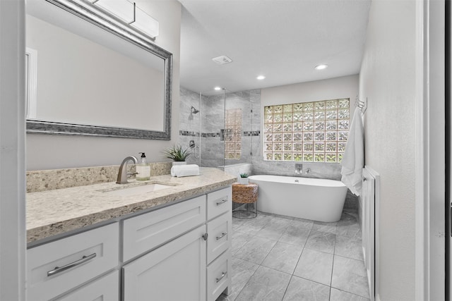 1139 Lehman St, Houston, TX 77018 - full bathroom with vanity, a soaking tub, tiled shower, recessed lighting, and marble finish flooring