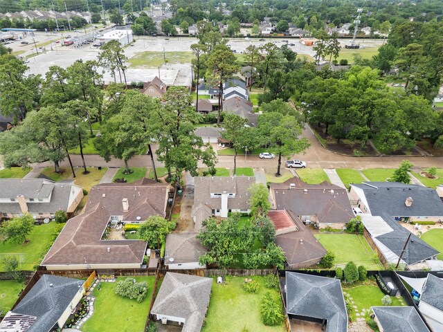 1139 Lehman St, Houston, TX 77018 - aerial view of property and surrounding area featuring nearby suburban area and a tree filled landscape