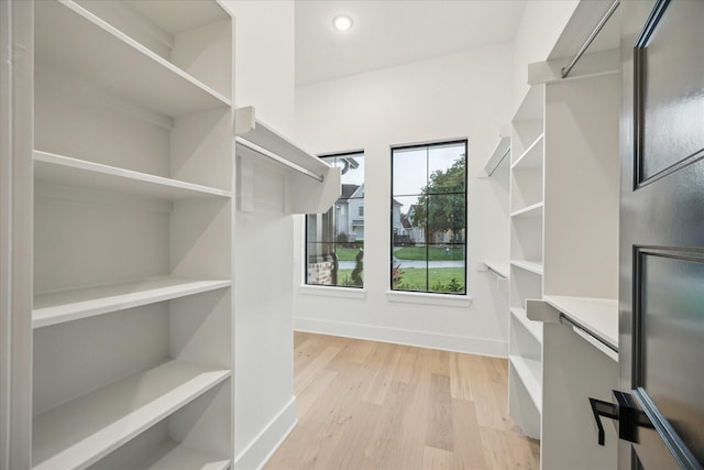 1112 Kinley Ln, Houston, TX 77018 - walk in closet with light wood-style flooring