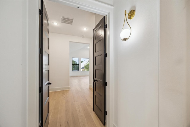 1112 Kinley Ln, Houston, TX 77018 - hallway featuring light wood-style floors and baseboards