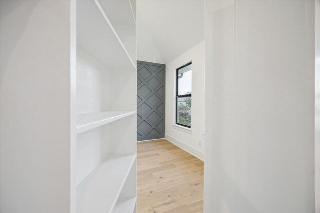 1112 Kinley Ln, Houston, TX 77018 - walk in closet featuring light wood-type flooring and vaulted ceiling