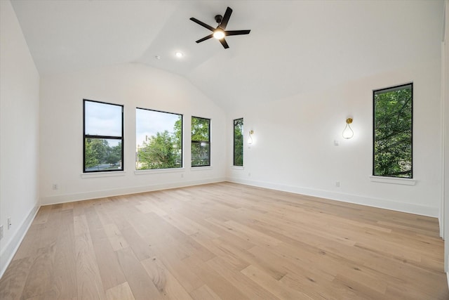 1112 Kinley Ln, Houston, TX 77018 - empty room featuring healthy amount of natural light, vaulted ceiling, a ceiling fan, and light wood-style floors
