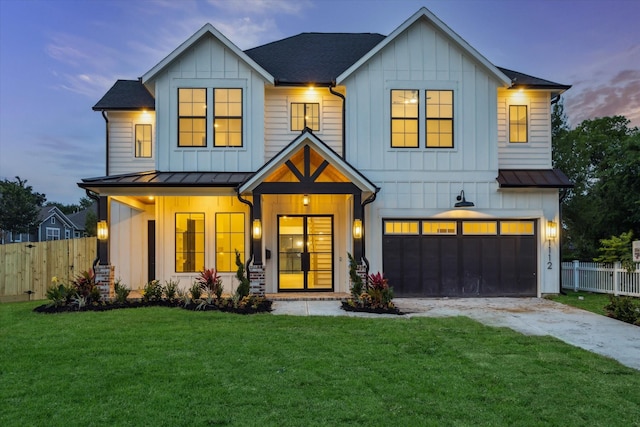 1112 Kinley Ln, Houston, TX 77018 - modern farmhouse featuring board and batten siding, a standing seam roof, a garage, and driveway