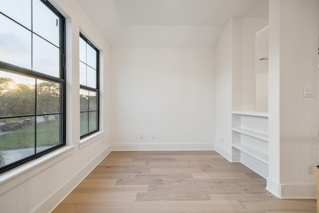 1112 Kinley Ln, Houston, TX 77018 - unfurnished room with plenty of natural light, light wood-style flooring, and built in shelves