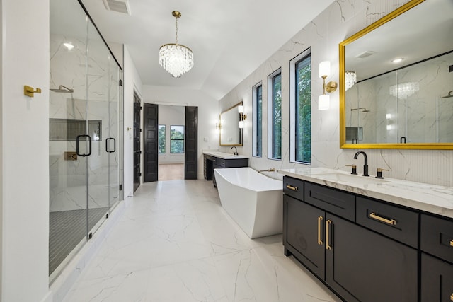 1112 Kinley Ln, Houston, TX 77018 - bathroom featuring marble tiled flooring, a marble finish shower, two vanities, a chandelier, and a soaking tub