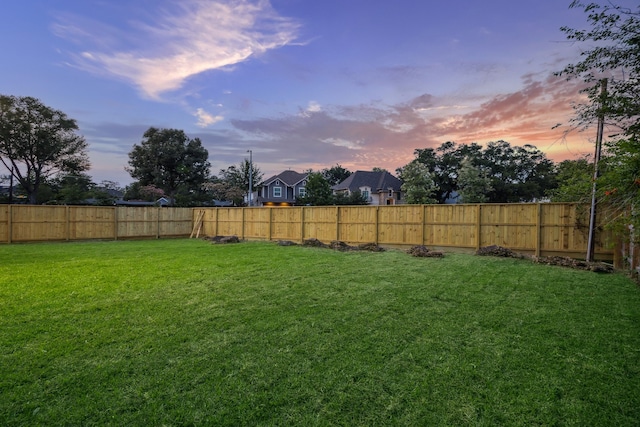 1112 Kinley Ln, Houston, TX 77018 - yard at dusk featuring a fenced backyard