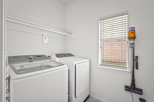 1706 Brightlake Way, Missouri City, TX 77459 - laundry area with separate washer and dryer and baseboards