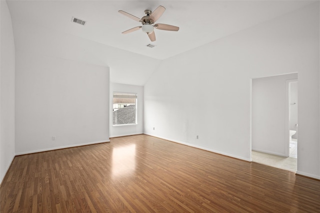 1706 Brightlake Way, Missouri City, TX 77459 - empty room with wood finished floors, a ceiling fan, vaulted ceiling, and baseboards